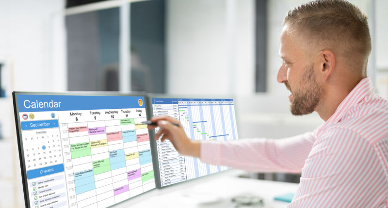 manager creating a schedule on a calendar