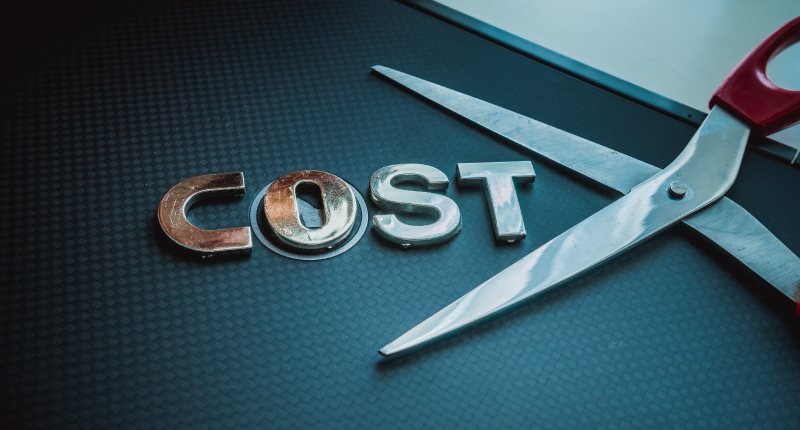steel scissor next to the word cost to show cost cutting