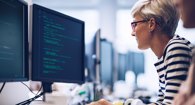 A computer programmer working on new software in the office